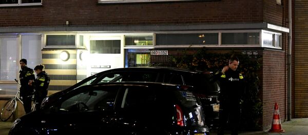 Police officers are seen in front the building where the main suspect of the shooting has been arrested in Utrecht, Netherlands, March 18, 2019. Police officers are seen in front the building where the main suspect of the shooting has been arrested in Utrecht, Netherlands, March 18, 2019. - Sputnik International