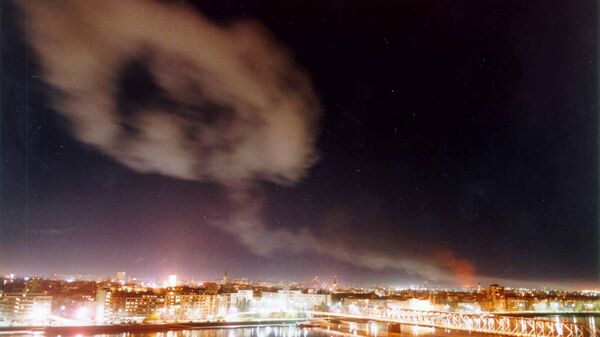 Smoke rises over Novi Sad during 1999 NATO bombing of Yugoslavia. - Sputnik International