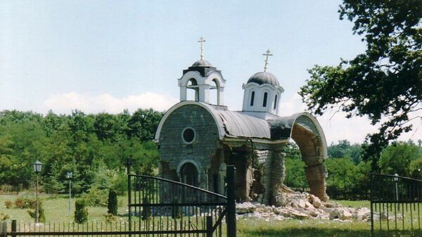 Holy Trinity Church in Petric, Kosovo in July 1999, heavily damaged after the arrival of Italian troops part of a NATO 'peacekeeping' contingent. Leveled completely by Kosovar Albanian militants in August 1999.  - Sputnik International