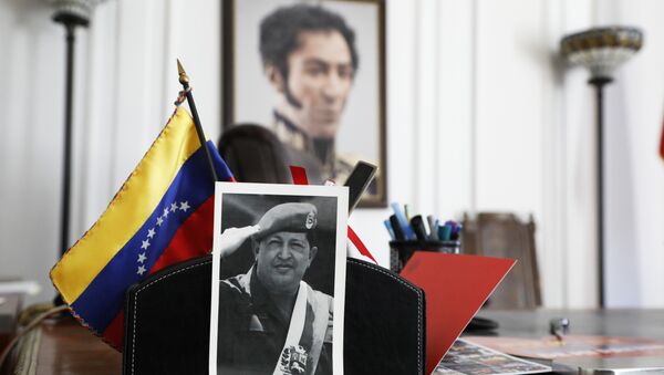 A photograph of Venezuela's late President Hugo Chavez and a painting of Venezuelan independence hero Simon Bolivar sit in an office at the Venezuelan consulate, two days after it was taken over by supporters of self-declared interim president of Venezuela, Juan Guaido, in New York, Wednesday, March 20, 2019. In Caracas, the Venezuelan government of President Nicolas Maduro denounced the forced and illegal occupation of some of its diplomatic headquarters in the United States. - Sputnik International