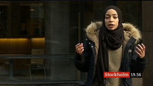 Screenshot from SVT Local news programme 20.03.2019 featuring a veiled anchor - Sputnik International