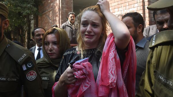 Czech model Tereza Hluskova weeps after the court decision to sentence her to eight years and eight months in prison for attempted heroin smuggling, in Lahore on March 20, 2019. A Pakistan court sentenced Czech national Tereza Hluskova to eight years and eight months in prison after she was found carrying eight and a half kilogrammes of heroin last year from Lahore’s Allama Iqbal International Airport. - Sputnik International