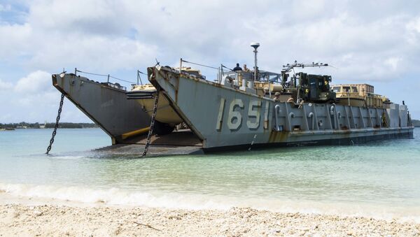 Landing Craft, Utility (LCU) 1651, assigned to Naval Beach Unit (NBU) 7, stands by to retrieve Marines assigned to the 31st Marine Expeditionary Unit (MEU) during a simulated beach raid. The amphibious transport dock ship USS Green Bay (LPD 20), part of the Commander Amphibious Squadron 11, is operating in the region to enhance interoperability with partners and serve as a ready-response force for any type of contingency. - Sputnik International
