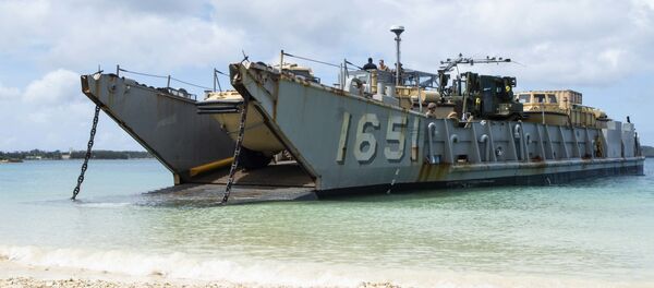 Landing Craft, Utility (LCU) 1651, assigned to Naval Beach Unit (NBU) 7, stands by to retrieve Marines assigned to the 31st Marine Expeditionary Unit (MEU) during a simulated beach raid. The amphibious transport dock ship USS Green Bay (LPD 20), part of the Commander Amphibious Squadron 11, is operating in the region to enhance interoperability with partners and serve as a ready-response force for any type of contingency. Landing Craft, Utility (LCU) 1651, assigned to Naval Beach Unit (NBU) 7, stands by to retrieve Marines assigned to the 31st Marine Expeditionary Unit (MEU) during a simulated beach raid. The amphibious transport dock ship USS Green Bay (LPD 20), part of the Commander Amphibious Squadron 11, is operating in the region to enhance interoperability with partners and serve as a ready-response force for any type of contingency. - Sputnik International