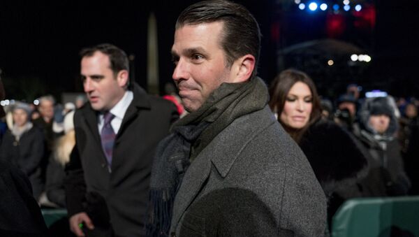 Donald Trump Jr., center, and Kimberly Guilfoyle, right, depart following the National Christmas Tree lighting ceremony at the Ellipse near the White House in Washington, Wednesday, Nov. 28, 2018 - Sputnik International