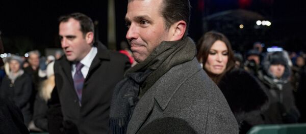 Donald Trump Jr., center, and Kimberly Guilfoyle, right, depart following the National Christmas Tree lighting ceremony at the Ellipse near the White House in Washington, Wednesday, Nov. 28, 2018 - Sputnik International
