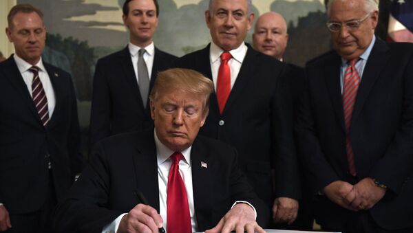 President Donald Trump, front, signs a proclamation in the Diplomatic Reception Room at the White House in Washington, Monday, March 25, 2019 - Sputnik International