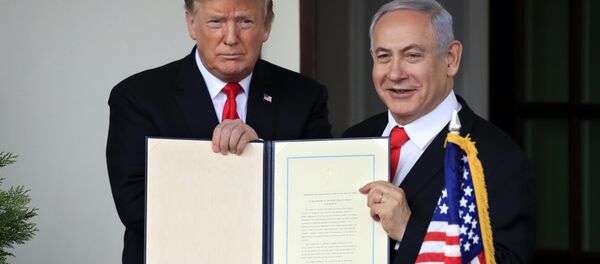 U.S. President Donald Trump and Israel's Prime Minister Benjamin Netanyahu hold up a proclamation recognizing Israel's sovereignty over the Golan Heights as Netanyahu exits the White House from the West Wing in Washington, U.S. March 25, 2019 U.S. President Donald Trump and Israel's Prime Minister Benjamin Netanyahu hold up a proclamation recognizing Israel's sovereignty over the Golan Heights as Netanyahu exits the White House from the West Wing in Washington, U.S. March 25, 2019 - Sputnik International
