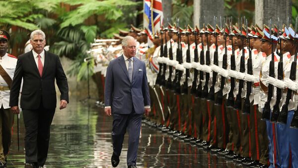 Cuba's President Miguel Diaz-Canel and Britain's Prince Charles review an honour guard during a ceremony at the Revolution Palace in Havana - Sputnik International