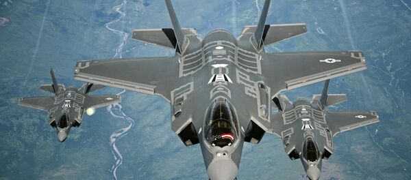 F-35A Lightning II aircraft receive fuel from a KC-10 Extender from Travis Air Force Base, Calif., July 13, 2015, during a flight from England to the U.S. The fighters were returning to Luke AFB, Ariz., after participating in the world's largest air show, the Royal International Air Tattoo. F-35A Lightning II aircraft receive fuel from a KC-10 Extender from Travis Air Force Base, Calif., July 13, 2015, during a flight from England to the U.S. The fighters were returning to Luke AFB, Ariz., after participating in the world's largest air show, the Royal International Air Tattoo. - Sputnik International