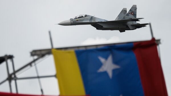 Russian-made Venezuelan Air Force Sukhoi Su-30MKV multirole strike fighters overfly a military parade to celebrate Venezuela's 206th anniversary of its Independence in Caracas on July 5, 2017 - Sputnik International