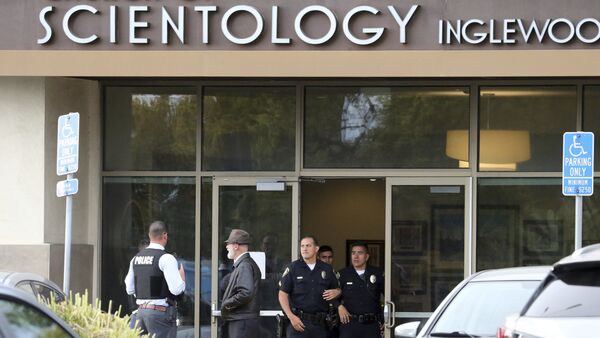 Police stand by outside and investigators work inside the entrance to the Church of Scientology in Inglewood, Calif., Wednesday, March 27, 2019. - Sputnik International