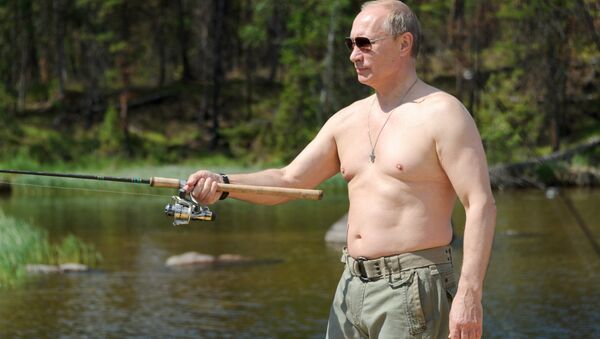 File photo: Russian President Vladimir Putin fishes in the Tuva Republic. 20 July 2013 - Sputnik International