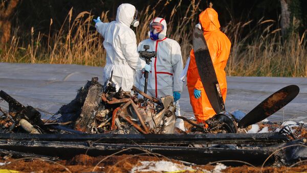 Forensic experts work next to the remains of a small plane that crashed near Erzhausen, Germany April 1, 2019. Natalia Fileva, chairwoman and co-owner of Russia's second largest airline S7, died when a private jet she was in crashed near Frankfurt on Sunday, the company said - Sputnik International