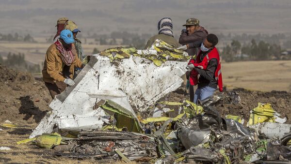 Rescuers work at the scene of an Ethiopian Airlines flight crash near Bishoftu, or Debre Zeit, south of Addis Ababa, Ethiopia, Monday, March 11, 2019 - Sputnik International
