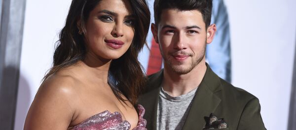 Cast member Priyanka Chopra and her husband Nick Jonas arrive at the Los Angeles premiere of Isn't It Romantic at The Theatre at Ace Hotel on Monday, Feb. 11, 2019 Cast member Priyanka Chopra and her husband Nick Jonas arrive at the Los Angeles premiere of Isn't It Romantic at The Theatre at Ace Hotel on Monday, Feb. 11, 2019 - Sputnik International