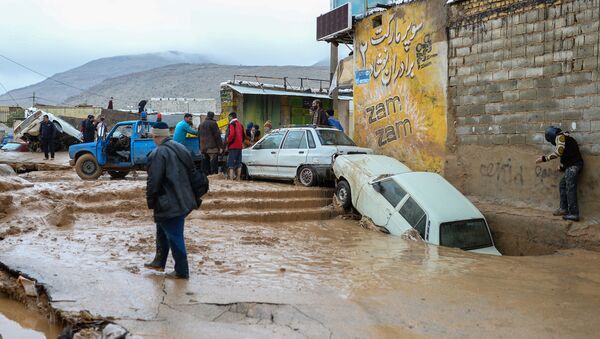 Damaged vehicles are seen after a flash flooding in Shiraz, Iran, March 26, 2019 - Sputnik International