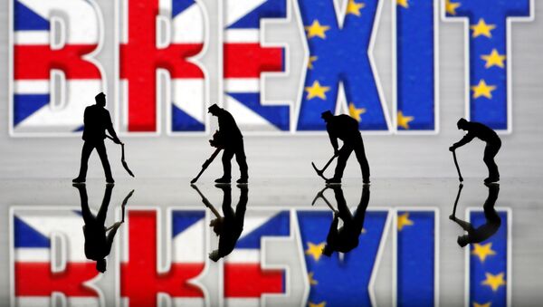 Small toy figures are seen in front of a Brexit logo in this illustration picture, March 30, 2019 - Sputnik International