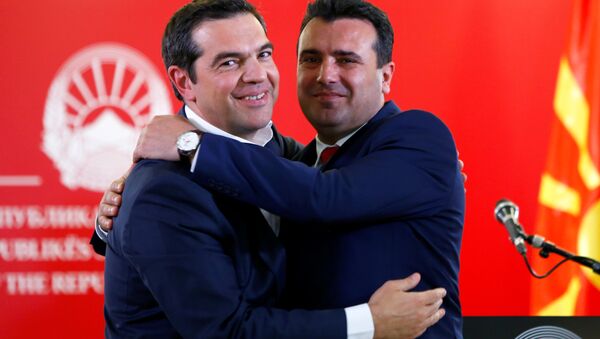Greek Prime Minister Alexis Tsipras and North Macedonia's Prime Minister Zoran Zaev hug as they attend a news conference in Skopje, North Macedonia April 2, 2019. - Sputnik International