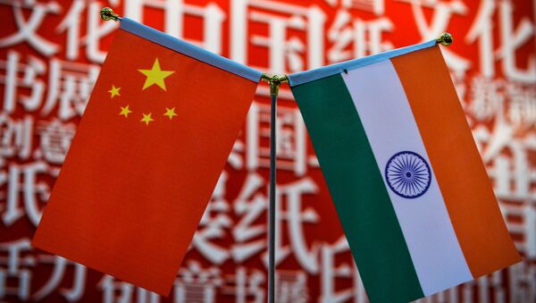 The national flags of India (R) and China are seen at the Delhi World Book fair at Pragati Maidan in New Delhi on January 9, 2016 - Sputnik International