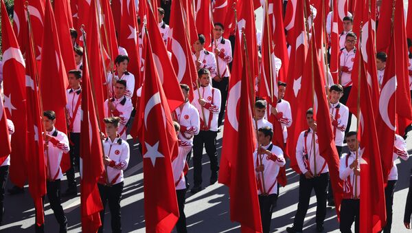 Students hold Turkish flags prior to a ceremony at the mausoleum of Turkey's founder Mustafa Kemal Ataturk on Republic Day in Ankara, Turkey, Monday, Oct. 29, 2018 - Sputnik International