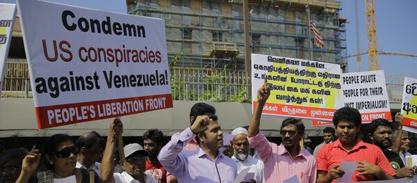 People's Liberation Front, members shout slogans against the U.S. during a protest in solidarity with Venezuelan president Nicolas Maduro outside the U.S. embassy in Colombo, Sri Lanka People's Liberation Front, members shout slogans against the U.S. during a protest in solidarity with Venezuelan president Nicolas Maduro outside the U.S. embassy in Colombo, Sri Lanka - Sputnik International