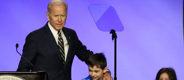Former Vice President Joe Biden is joined by some children on stage Former Vice President Joe Biden is joined by some children on stage - Sputnik International