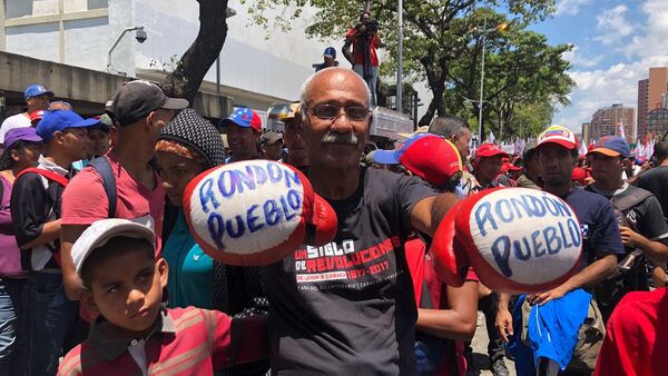 Manifestante de la marcha chavista convocada en Venezuela el 6 de abril de 2019 - Sputnik International