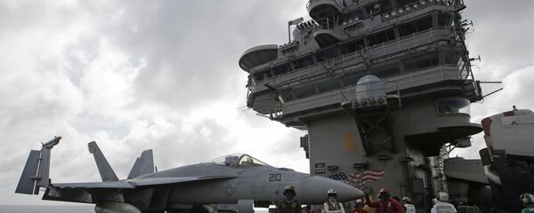 An F/A-18 Super Hornet fighter jet is seen on the deck of the U.S. Navy USS Ronald Reagan in the South China Sea An F/A-18 Super Hornet fighter jet is seen on the deck of the U.S. Navy USS Ronald Reagan in the South China Sea - Sputnik International