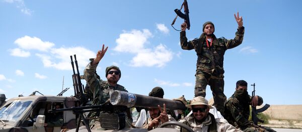 Libyan National Army (LNA) members, commanded by Khalifa Haftar, head out of Benghazi to reinforce the troops advancing to Tripoli, in Benghazi, Libya April 7, 2019 - Sputnik International