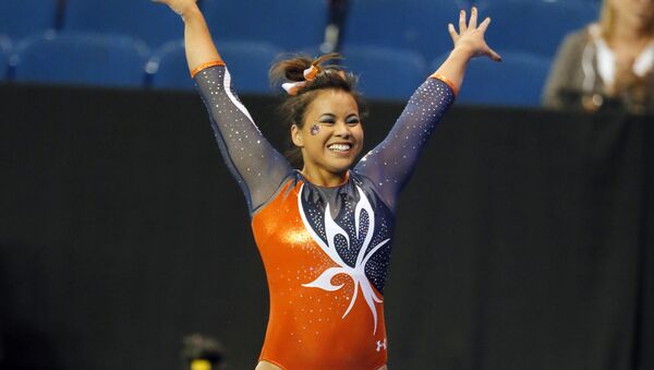 Auburn's Samantha Cerio celebrates her balance beam routine during the NCAA women's gymnastics championships, Friday, April 15, 2016, in Fort Worth, Texas. - Sputnik International