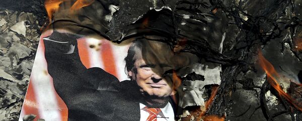 A poster of the U.S. President Donald Trump is set on fire during the annual anti-Israeli Al-Quds, Jerusalem, Day rally in Tehran, Iran, Friday, June 8, 2018 - Sputnik International