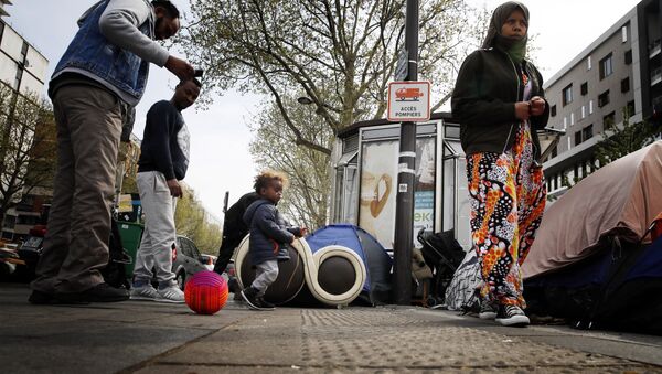 Migrants mainly from Sudan, Chad, and Afghanistan, gather in a makeshift camp along side the Porte d'Aubervilliers, in Paris Monday, April 8, 2019 - Sputnik International