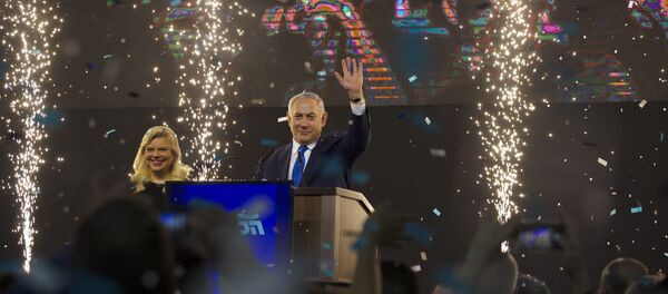 Israel's Prime Minister Benjamin Netanyahu accompanied by his wife Sara waves to his supporters after polls for Israel's general elections closed in Tel Aviv, Israel, Wednesday, April 10, 2019 Israel's Prime Minister Benjamin Netanyahu accompanied by his wife Sara waves to his supporters after polls for Israel's general elections closed in Tel Aviv, Israel, Wednesday, April 10, 2019 - Sputnik International