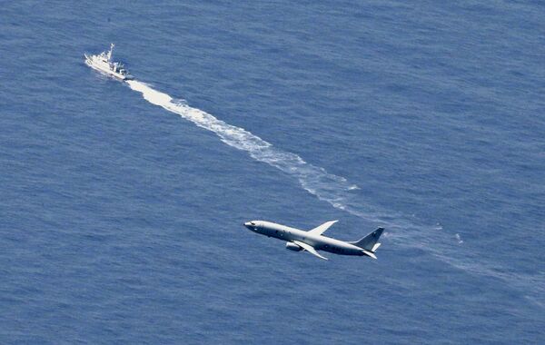 A Japan Coast Guard vessel and a U.S. military aircraft conduct rescue and search operations at the site where an Air Self-Defense Force's F-35A stealth fighter jet crashed during an exercise on April 9, 2019, off Aomori prefecture, Japan, in this photo taken by Kyodo April 10, 2019 A Japan Coast Guard vessel and a U.S. military aircraft conduct rescue and search operations at the site where an Air Self-Defense Force's F-35A stealth fighter jet crashed during an exercise on April 9, 2019, off Aomori prefecture, Japan, in this photo taken by Kyodo April 10, 2019 - Sputnik International