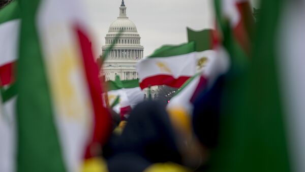 The Dome of the U.S. Capitol building is visible through Iranian flags during an Organization of Iranian-American Communities rally at Freedom Plaza in Washington, Friday, March 8, 2019. (AP Photo/Andrew Harnik) - Sputnik International