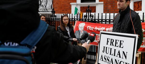 A supporter of WikiLeaks founder Julian Assange talks to the media, after Assange was arrested by British police, outside the Ecuadorian embassy in London, Britain, April 11, 2019 A supporter of WikiLeaks founder Julian Assange talks to the media, after Assange was arrested by British police, outside the Ecuadorian embassy in London, Britain, April 11, 2019 - Sputnik International