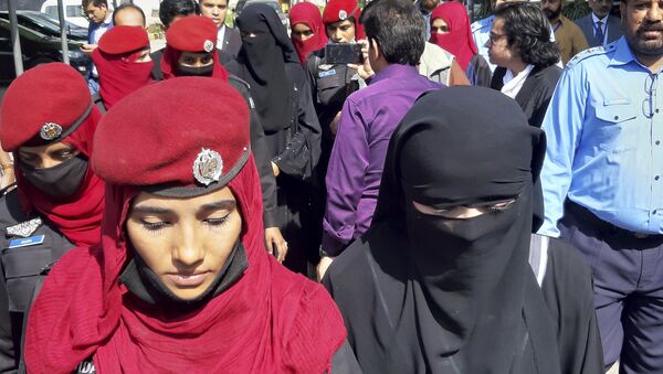 Pakistani girls from the Hindu community wearing black veils, arrive at a court in Islamabad, Pakistan, Tuesday, March 26, 2019. A Pakistani court placed two teenage sisters from the minority Hindu community in a government shelter on Tuesday as authorities launched an investigation into whether the girls were abducted and forced to convert and marry two Muslim men - Sputnik International