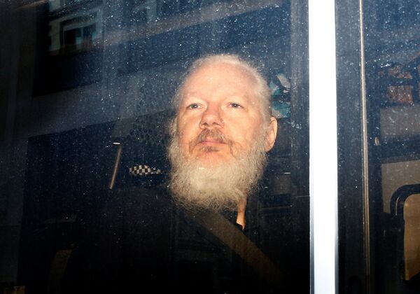 WikiLeaks founder Julian Assange is seen in a police van, after he was arrested by British police, in London, Britain April 11, 2019 WikiLeaks founder Julian Assange is seen in a police van, after he was arrested by British police, in London, Britain April 11, 2019 - Sputnik International
