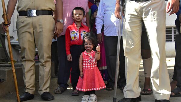 Jyoti Amge, 25, who holds the Guinness World Records title for the Shortest Living Woman, shows her ink-marked finger after casting her vote at a polling station during the first phase of the general election in Nagpur, India, April 11, 2019 - Sputnik International