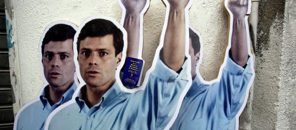Supporters placed life-size cardboard cutouts of opposition leader Leopoldo Lopez outside the Justice Palace as the trial against Lopez for inciting violence at anti-government protests began, in Caracas, Venezuela, Wednesday, July 23, 2014 Supporters placed life-size cardboard cutouts of opposition leader Leopoldo Lopez outside the Justice Palace as the trial against Lopez for inciting violence at anti-government protests began, in Caracas, Venezuela, Wednesday, July 23, 2014 - Sputnik International