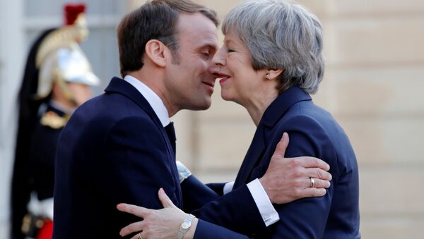 French President Emmanuel Macron welcomes British Prime Minister Theresa May as she arrives for a meeting to discuss Brexit, at the Elysee Palace in Paris, France, April 9, 2019 - Sputnik International