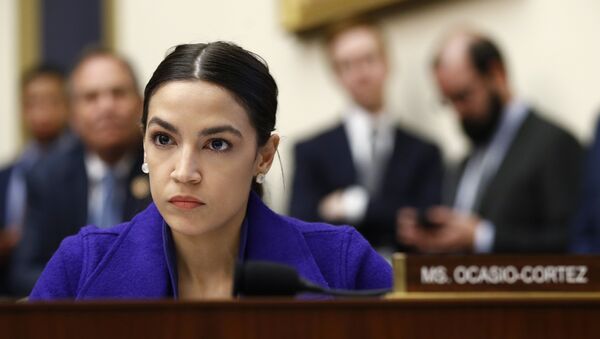 Rep. Alexandria Ocasio-Cortez, D-N.Y., listens during a House Financial Services Committee hearing with leaders of major banks, Wednesday, April 10, 2019, on Capitol Hill in Washington - Sputnik International