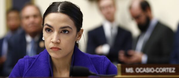 Rep. Alexandria Ocasio-Cortez, D-N.Y., listens during a House Financial Services Committee hearing with leaders of major banks, Wednesday, April 10, 2019, on Capitol Hill in Washington - Sputnik International