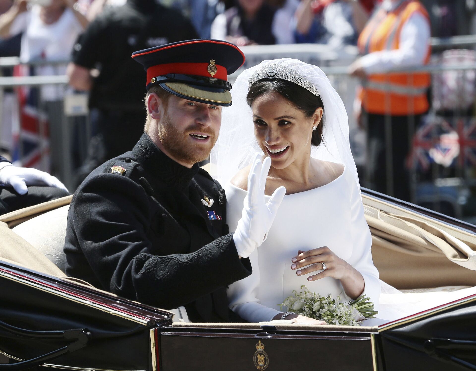 Britain's Prince Harry and Meghan Markle ride in an open-topped carriage after their wedding ceremony at St. George's Chapel in Windsor Castle in Windsor, near London, England, Saturday, May 19, 2018 - Sputnik International, 1920, 05.10.2021