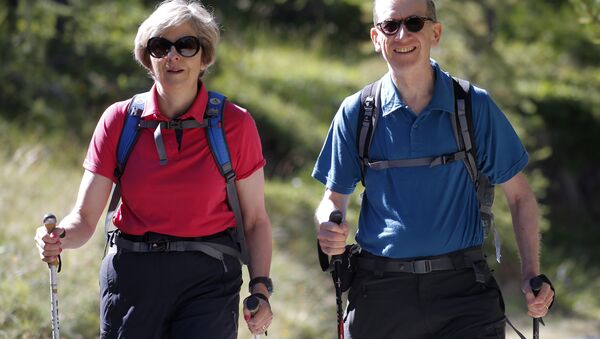 Theresa May and her husband on a walking holiday in Switzerland in 2016 - Sputnik International