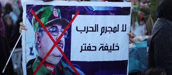 Libyan protesters attend a demonstration to demand an end to the Khalifa Haftar's offensive against Tripoli, in Martyrs Square in central Tripoli, Libya, 12 April, 2019 Libyan protesters attend a demonstration to demand an end to the Khalifa Haftar's offensive against Tripoli, in Martyrs Square in central Tripoli, Libya, 12 April, 2019 - Sputnik International