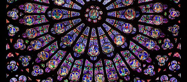 The north rose window of the Cathédrale Notre-Dame de Paris, an example of Rayonnant architecture, and the row of figures in stained glass below. The north rose window of the Cathédrale Notre-Dame de Paris, an example of Rayonnant architecture, and the row of figures in stained glass below. - Sputnik International