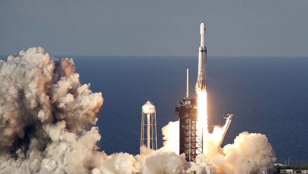 A SpaceX Falcon Heavy rocket carrying a communication satellite lifts off from pad 39A at the Kennedy Space Center in Cape Canaveral, Fla., Thursday, April 11, 2019 - Sputnik International