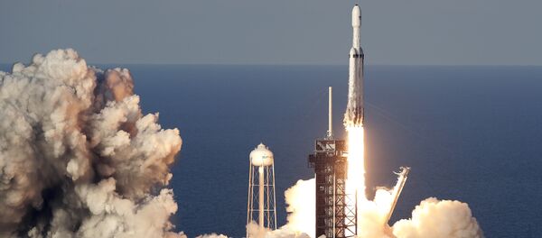 A SpaceX Falcon Heavy rocket carrying a communication satellite lifts off from pad 39A at the Kennedy Space Center in Cape Canaveral, Fla., Thursday, April 11, 2019 - Sputnik International